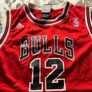 Used youth Chicago Bulls jersey by Adidas.